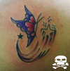borboleta com estrela tattoo