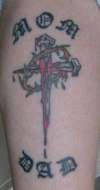 CC cross tattoo