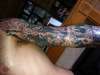 left sleeve upper arm tattoo