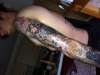 left sleeve upper arm tattoo