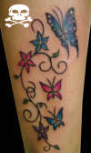 ramos com borboleta perna tattoo