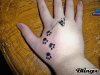Paw prints on my hand tattoo