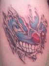 evil clown ripping out tattoo