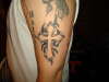 Cross tattoo with tribal