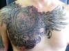 Winged chest tattoo