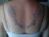 Wings on back tattoo