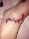 small blossom on ankle tattoo