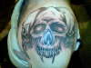 shoulder skulls tattoo