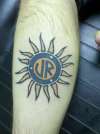 tribal sun with color tattoo