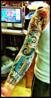 Left Arm Music Sleeve tattoo