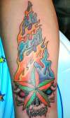 Skull with colored flames tattoo
