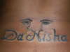 Crying Eyes and Name (lower back) tattoo