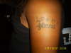 Daughter's Name on Arm tattoo