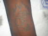 Initial C w/ Hundred inside (part 2 of 2) tattoo