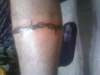 calf wrap barbed wire tattoo