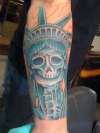 statue of liberty/skeleton face tattoo