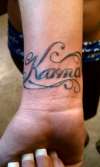 KARMA inside right wrist tattoo