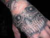 hand skull tattoo