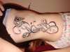 roses and swirls tattoo