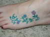 zodiac and flowers tattoo