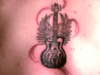 May his guitar R.I.P tattoo