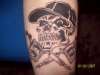 Skull with Tat Machines tattoo
