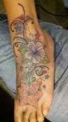 foot flowers tattoo