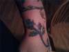 left arm rose and vine tattoo
