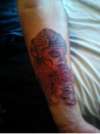 Sugar skull and rose tattoo