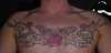 cherubs and filgree aross chest tattoo