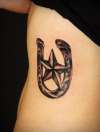 horse shoe and nautical star tattoo