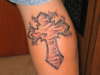 jaa,s cross tattoo