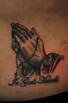 Praying hands tattoo