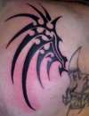 Tribal wings tattoo by trickstattoo
