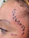 cheetah on face tattoo