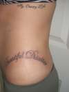 ribs n hip writing tattoo