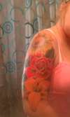 Colorful flower arm sleeve tattoo