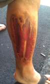 muscle rip leg tattoo