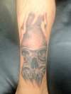 skull and smoke tattoo