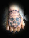 skull on hand tattoo