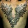 Cali's demon skull wings tattoo