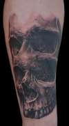 Double eye skull tattoo