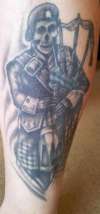 Scottish bagpiper tattoo