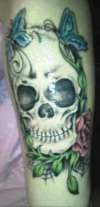 Skull w/ butterflies and rose tattoo