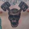 Skull with pistons tattoo