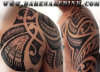 polynesian chest n arm tattoo