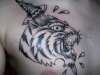 traditional tiger with dagger tattoo