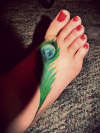 Peacock feather foot tattoo