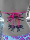 Pearls and ribbon tattoo