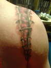 broken shoulder back tattoo